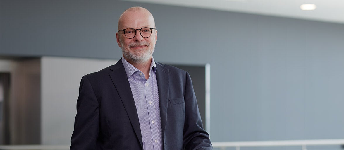 Executive member, Chris Keay, stood in Newcastle Building Societies head office. 