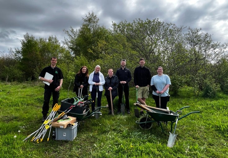 Members of our Product & Commercial department volunteering at Pegswood Community Park.