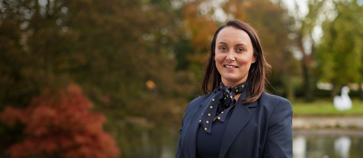 Sunderland Branch Manager, Donna, standing in a park smiling. 