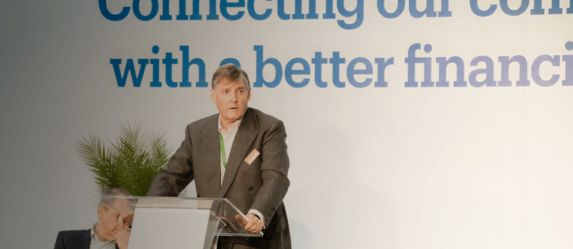 James Ramsbotham, standing at a podium