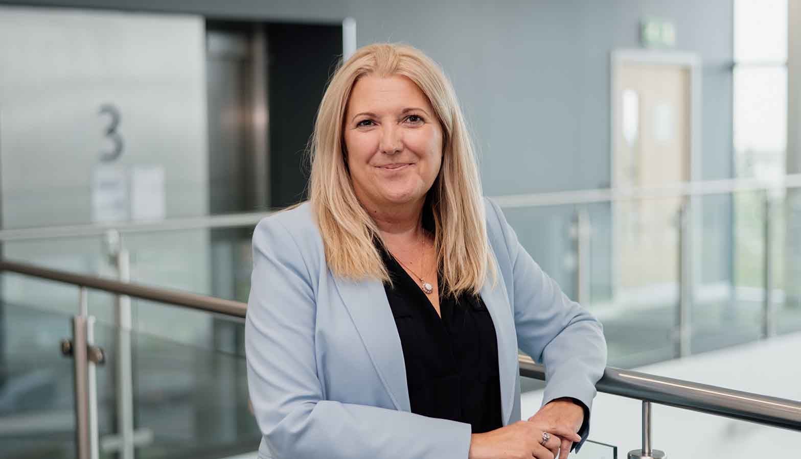 Board member, Karen McDonagh Reynolds, stood inside of Newcastle Building Societies head office. 