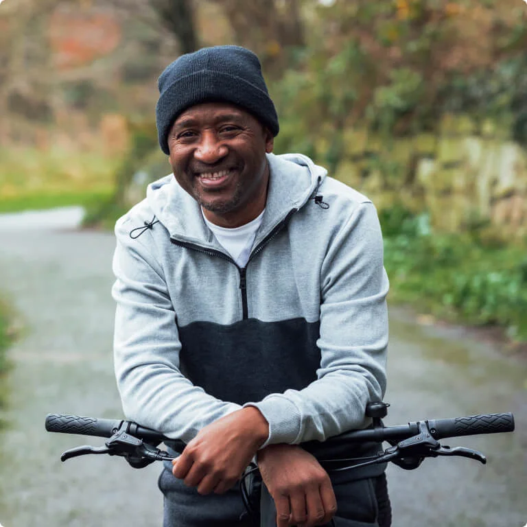 Man out for a cycle smiling.