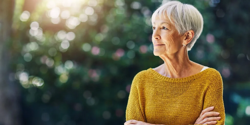 Woman looking content as she stares off into the distance