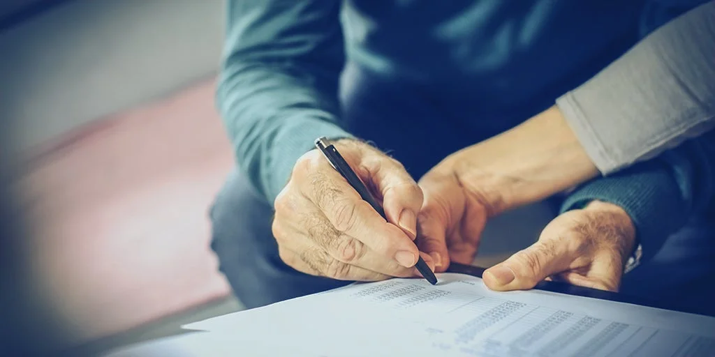 Man working out his current financial situation