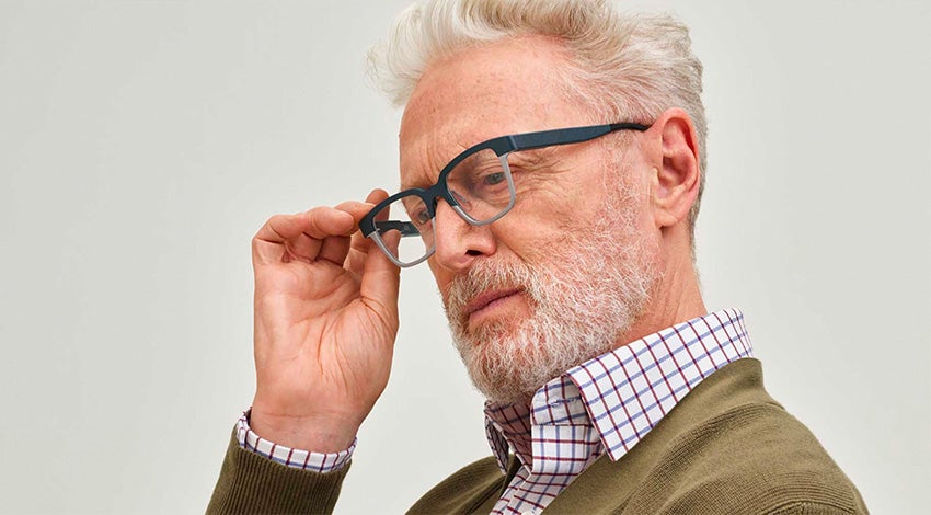 Older man wearing 3D-printed autofocal eyewear from Morrow