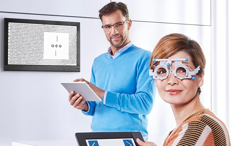 Woman having a HOYA EyeGenius examination done 