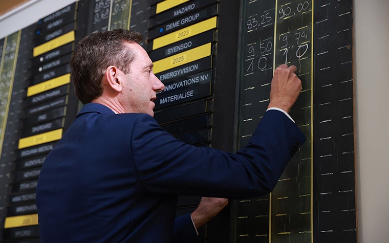 Materialise CFO Koen Berges writing on a board at Euronext Brussels