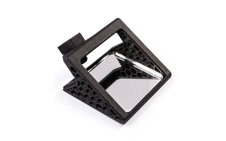 Un petit miroir noir imprimé en 3D pour les appareils iOS.