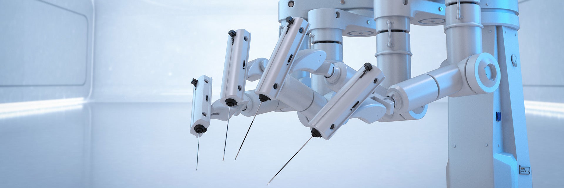 A surgical robot with four needles in a white, well-lit room.