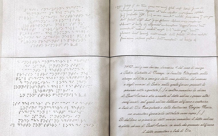 3D-printed replica of an ancient book with braille on one side