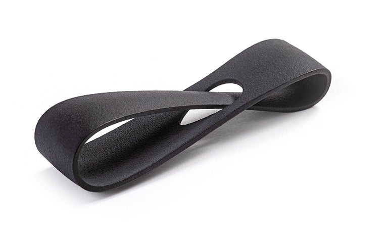 A black 3D-printed loop made in PA 12S using Multi Jet Fusion with a color dyed finish.