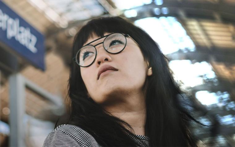 Model wearing NEON Berlin eyeglasses and looking up