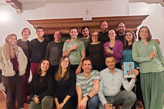 The software innovation team in Leuven. A group of men and woman are smiling at the camera.