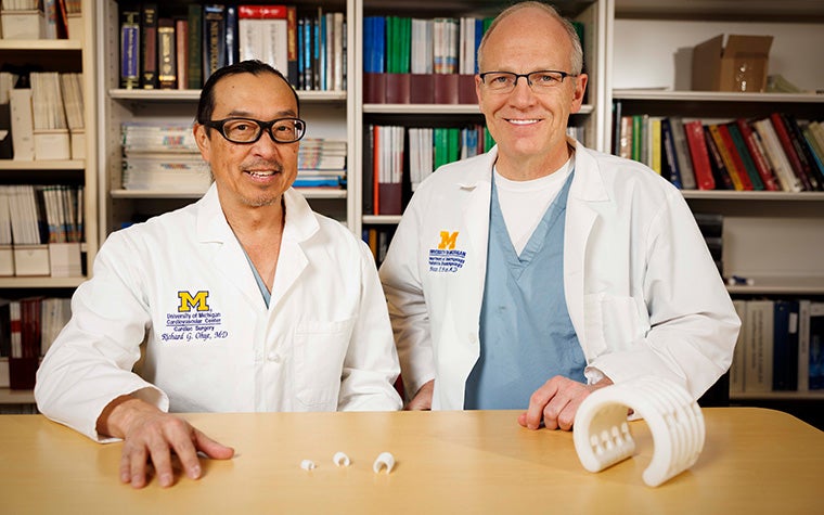 Dr. Richard Ohye and Dr. Glenn Green smiling in University of Michigan lab coats