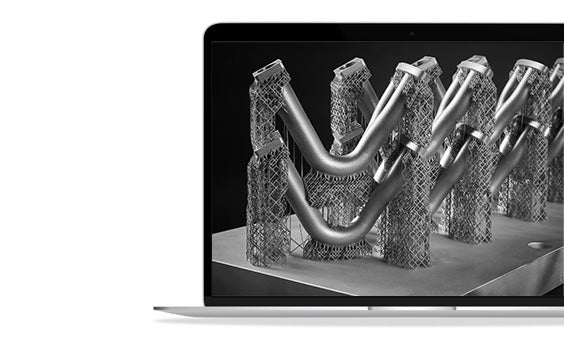 Metal 3D-printed parts held up on a plate by support structure