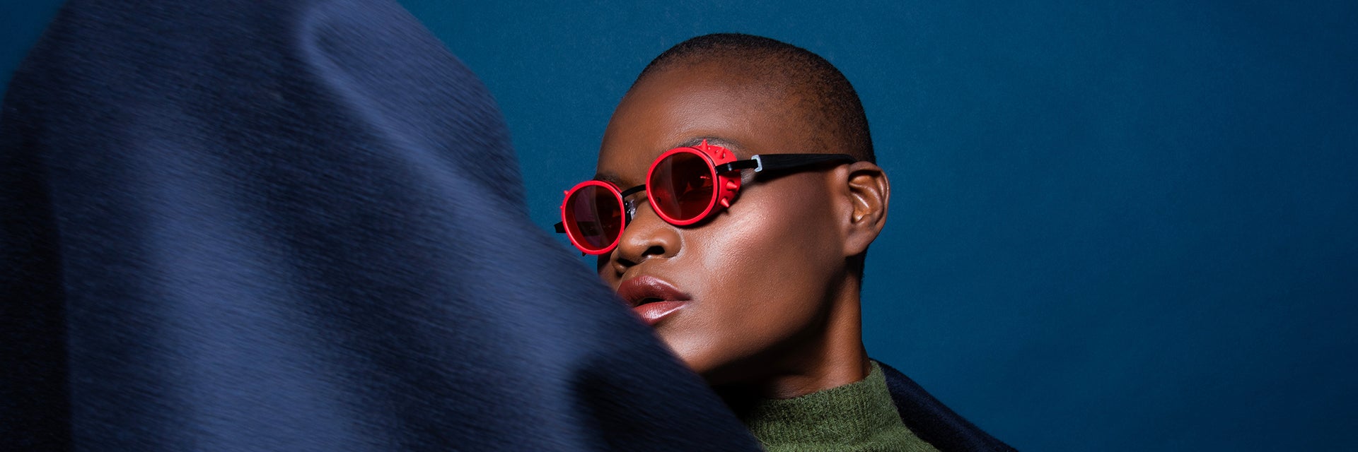 Model wearing red 3D-printed JF Rey frames  