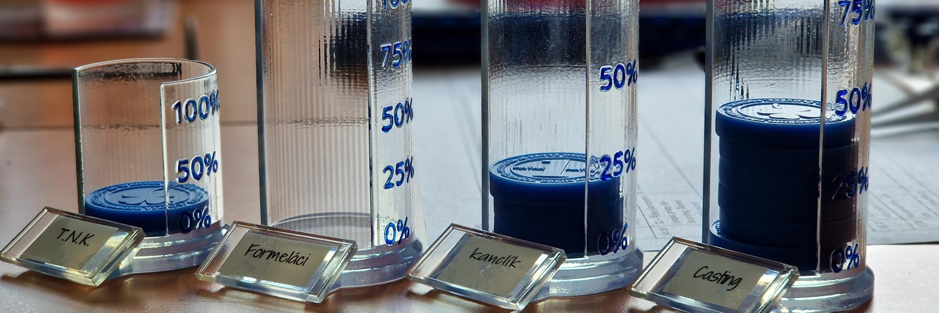 Containers that hold 3D-printed Matak coins for each office in Materialise's Czech office