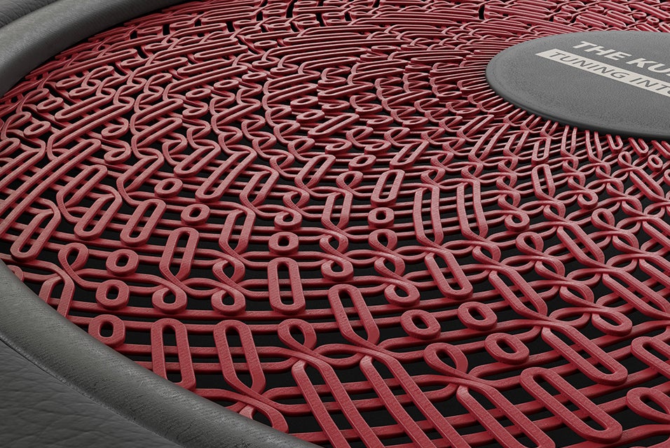 Red car speaker grill design with swirls 