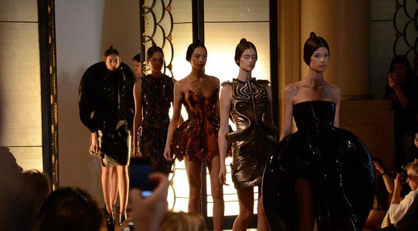 Models on a runway wearing 3D-printed designs