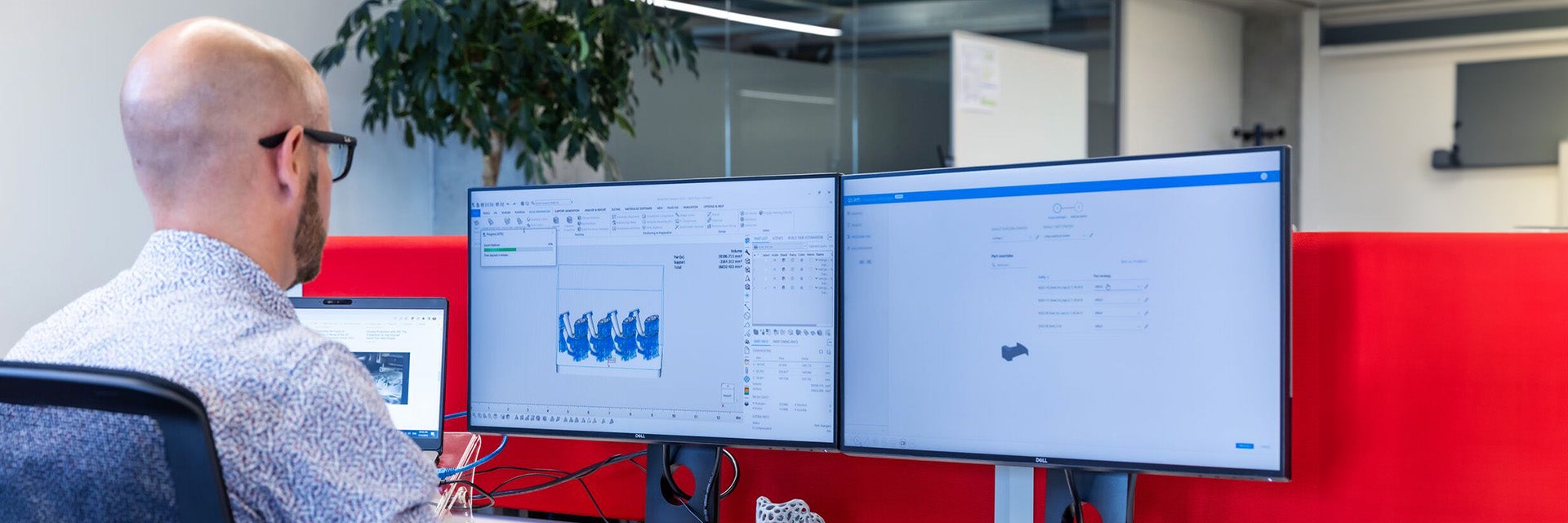 A man using a desktop PC with Load Balancer software.
