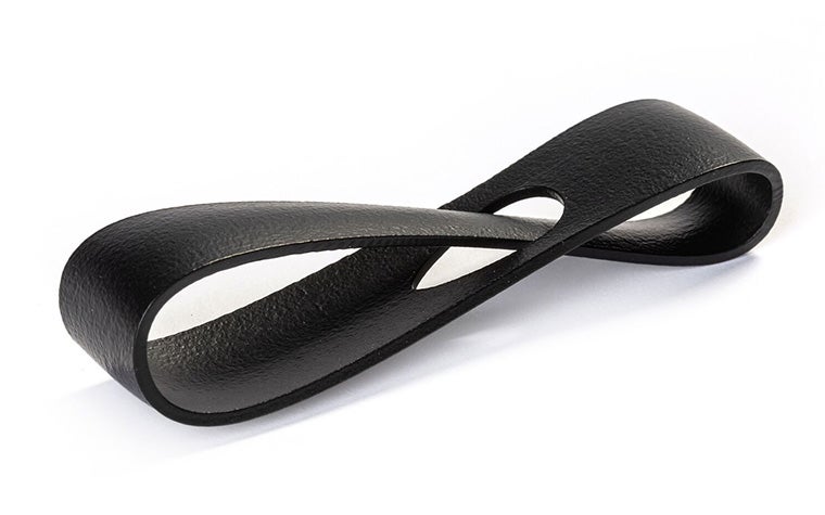 A black 3D-printed loop made from PA 12S using Multi Jet Fusion, with an extra smooth and color-dyed finish.