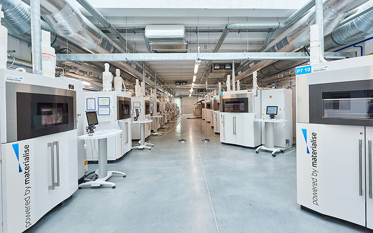 Rows of 3D printers in a Materialise production facility