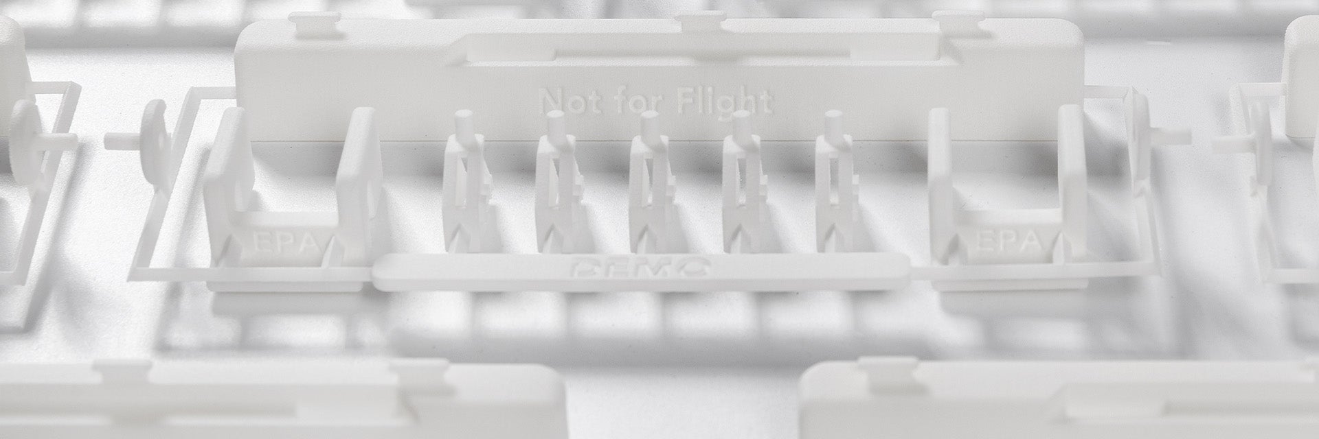 A series of white 3D-printed dado panel repair kits on a white background.