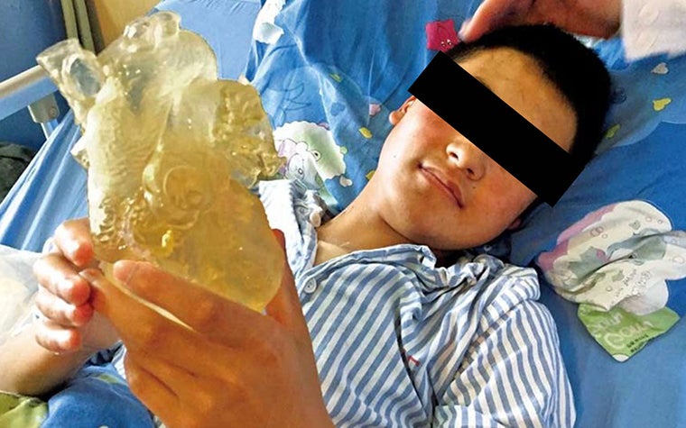 A 14-year-old boy in hospital recovering from heart surgery 