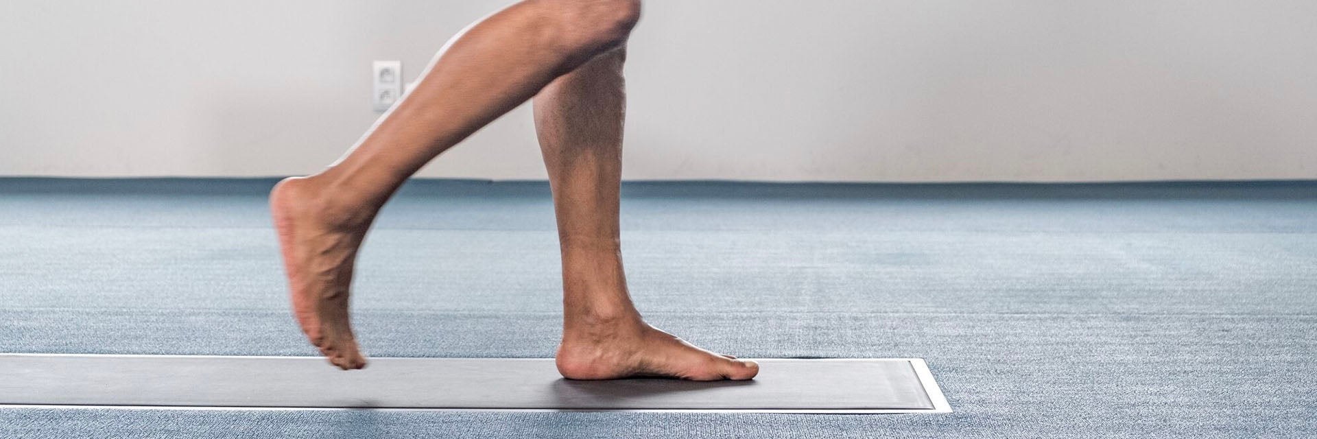Person walking on a foot scanner