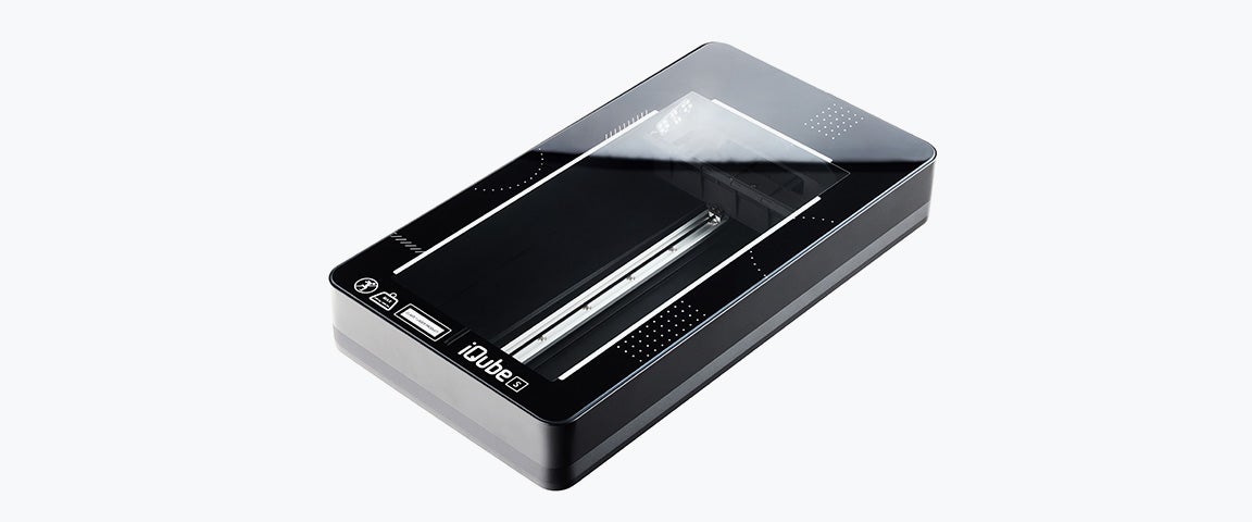 A black rectangular iCube S 3D scanner with a transparent top panel and internal scanning components visible.
