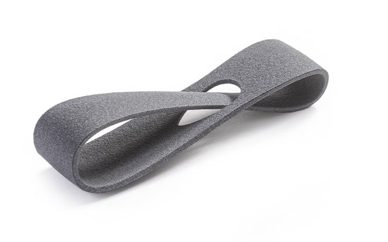 A gray 3D-printed loop made in PA 11 using Multi Jet Fusion with a normal finish.