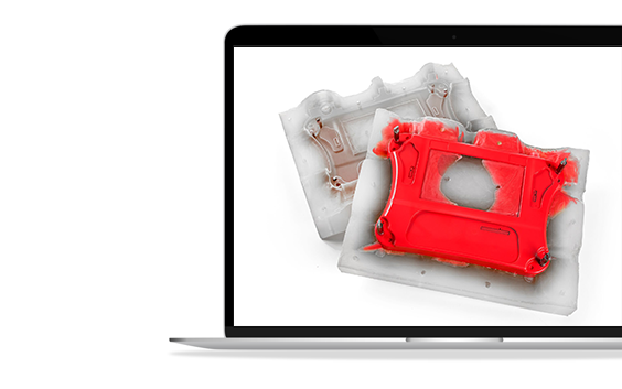 A laptop screen showing a red vacuum-cast housing on top of its silicone mold.