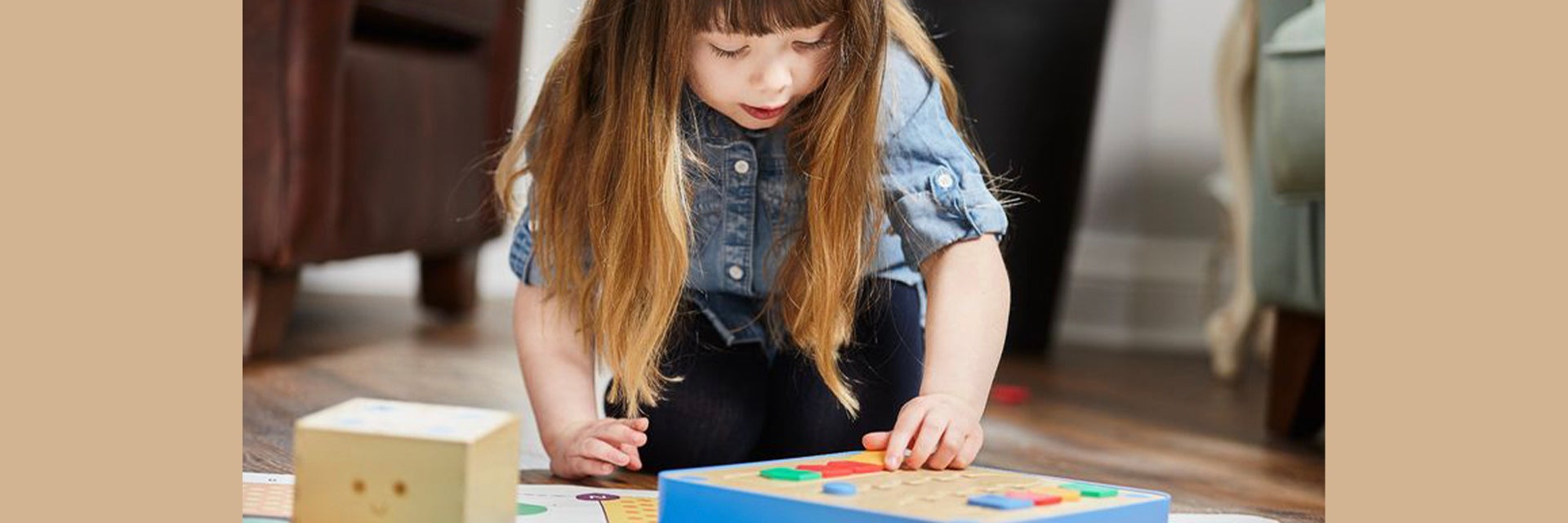 Little girls playing with a puzzle on the floor