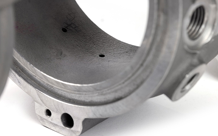 3d-printed-slm-aluminum-cmb-injection-manifold-machines-close-up.png