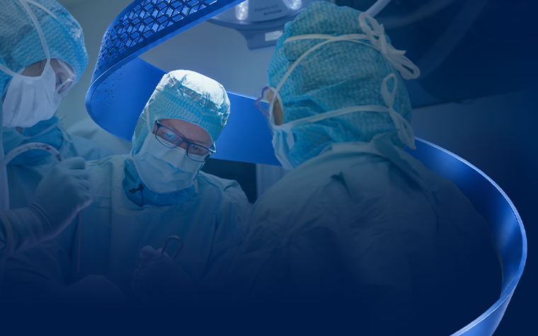 A group of surgeons in a operating room with the Materialise CMF signature blue swirl in the background.