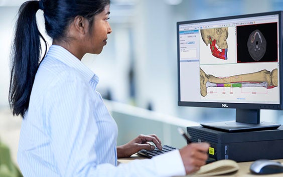 Doctor sitting at a computer using PROPLAN