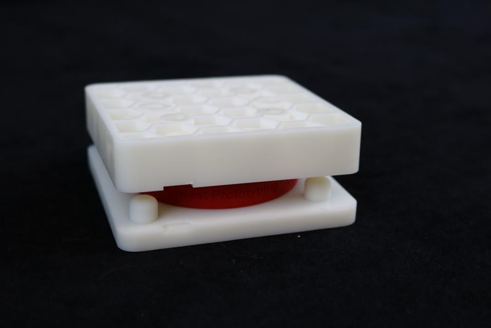 Honeycomb prototype with a red casted part inside