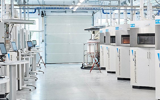 Row of 3D printers in the Materialise facilities
