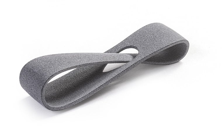 A gray 3D-printed loop made in PA 11 using Multi Jet Fusion with a smooth finish.
