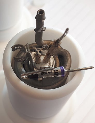 A close up of the fuse inserted into the metal 3D-printed heatsink taken from Metrohm Applikon's MARGA air pollution measurement system.