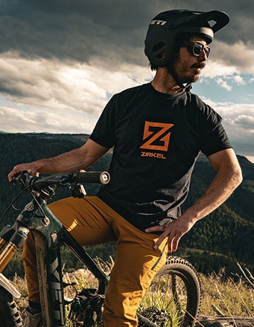 Trophy of Nations Champion mountain biker Shawn Neer sitting on a mountain bike wearing Zirkel's 3D-printed eyewear.