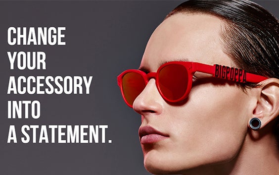 Model wearing red sunglasses that say Big Poppa