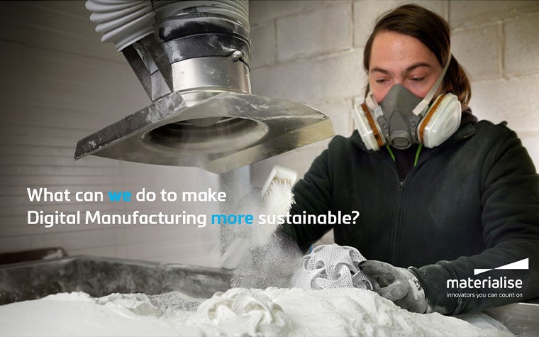 A production worker wearing a protective face mask removes a 3D-printed part from a powder bed.