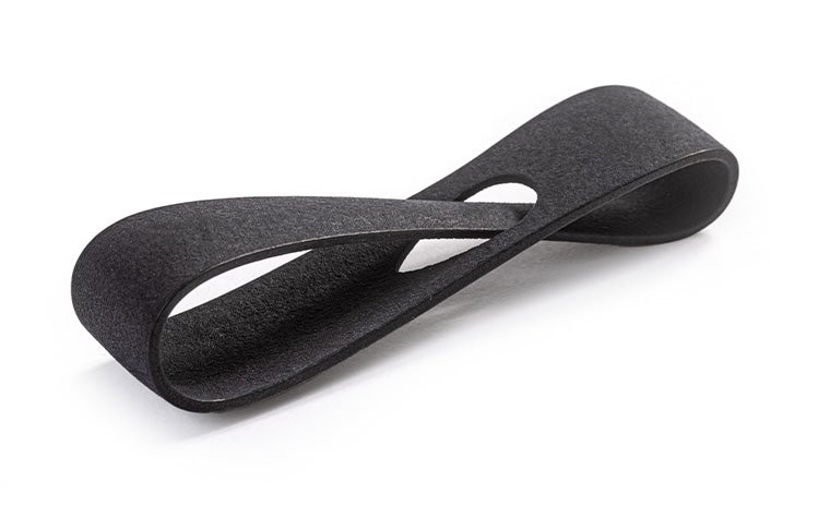 A black 3D-printed loop made in PA 11 using Multi Jet Fusion with a smooth + color dyed finish.