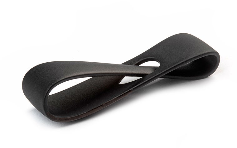 A black 3D-printed loop, finished with primer and a matte paint with 10 percent gloss.