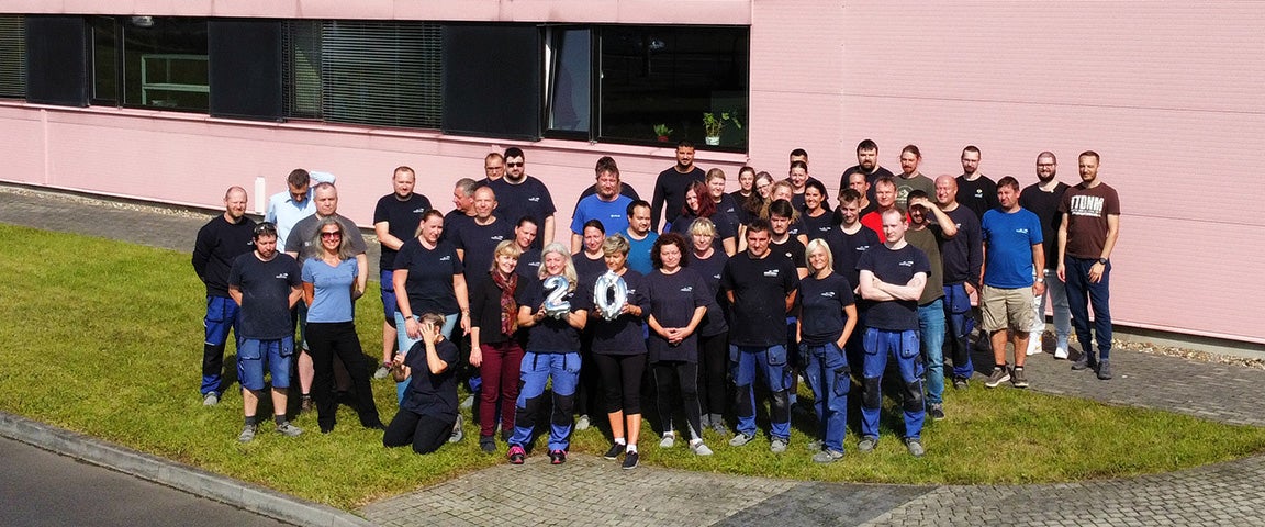 The full Materialise Czech Republic team standing outside the building