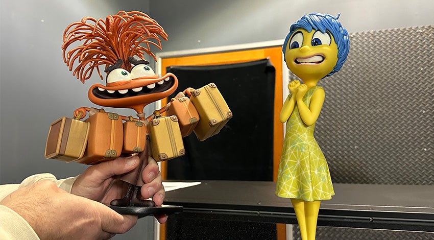 3D-printed, colorful models of Joy and Anxiety from Pixar's Inside Out 2, created by Gentle Giant Studio