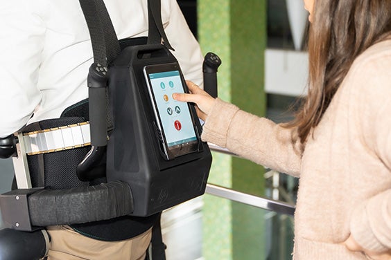 Someone pressing buttons on the HANK+ battery pack