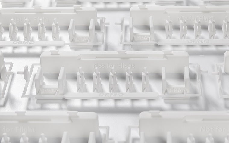 A series of white 3D-printed dado panel repair kits on a white background.