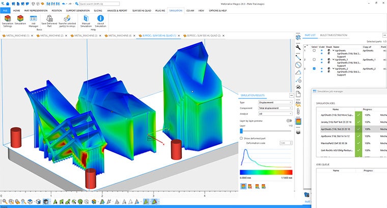 An image of a three 3D builds in the ansys simulation software. Each build shows areas with different tolerance levels. Two of the builds (in the centre and right) show blue and green areas that are within tolerance. The build on the left has areas near the base that are red indicating places where supports could be added.